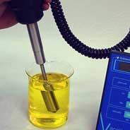 hand-held viscometer probe in sample